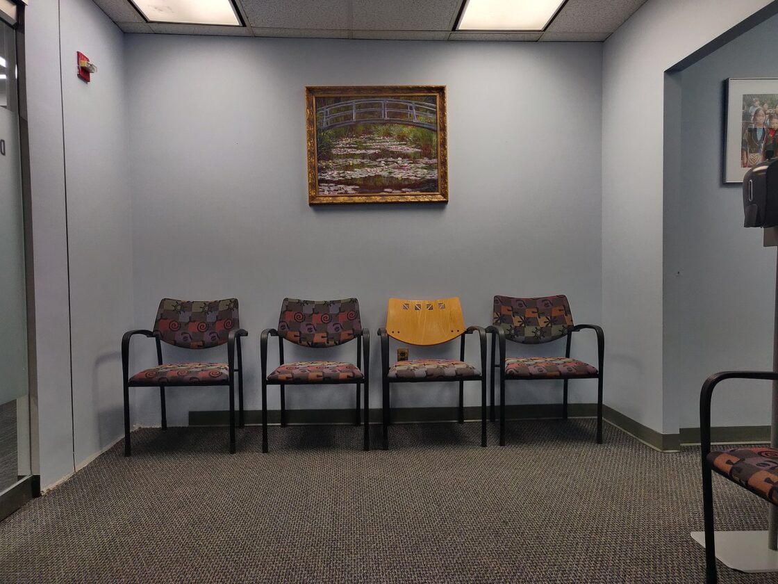 Four chairs in a doctor’s waiting room