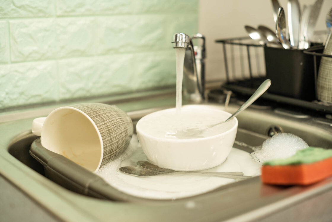 A sink full of dirty dishes