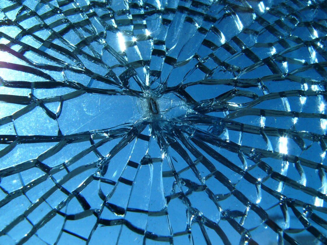 Shattered glass reflecting blue